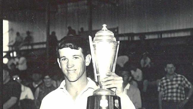 WIN: Casey O&#39;Connor lifts the Locke Trophy after his Stanthorpe side won the under-18s premiership more than 50 years ago. Picture: Contributed