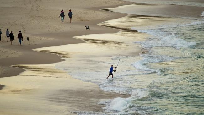 Beachgoers at dusk on Frenchmans Beach. Picture: Lachie Millard