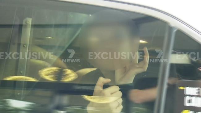 A female throws up gang signs. Picture: 7News Gold Coast.