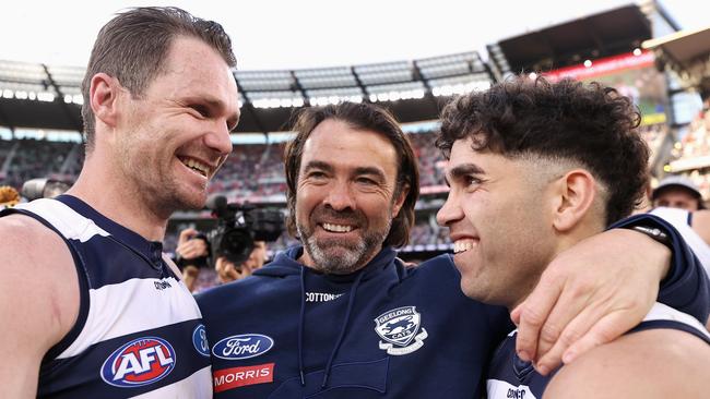 Chris Scott celebrates last year’s premiership with Patrick Dangerfield and Tyson Stengle. Picture: Getty Images