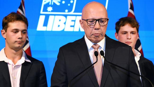 Opposition Leader Peter Dutton conceded defeat alongside his sons Harry and Tom on Saturday night. Picture: Getty Images