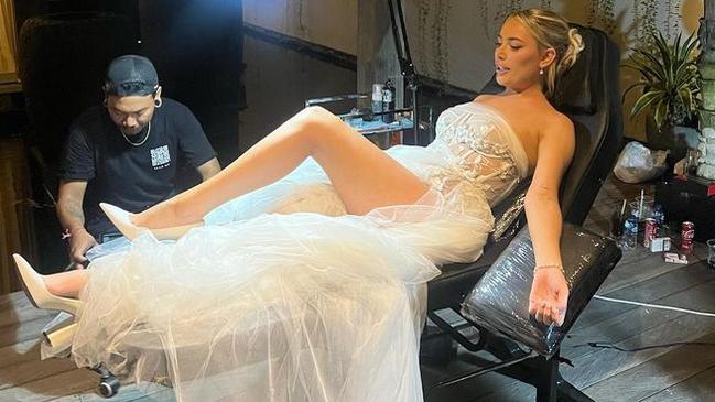 Logan Shine getting a tattoo on her wedding day.