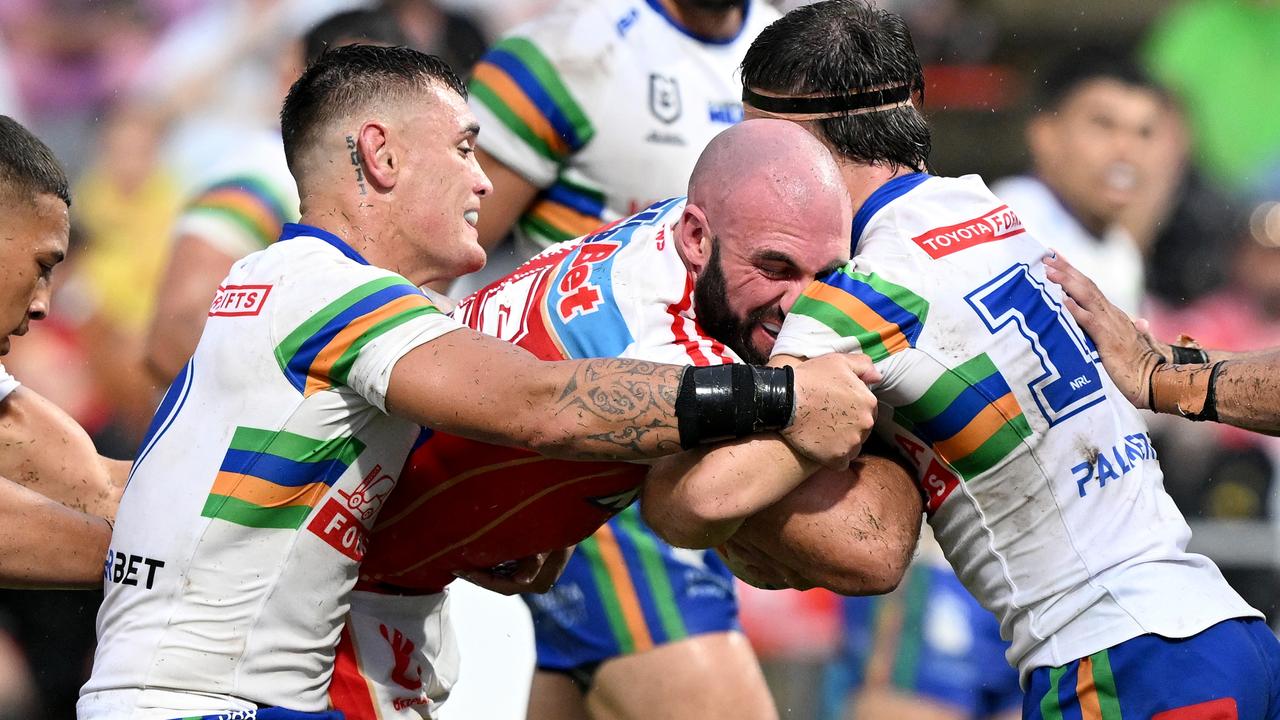 Mark Nicholls is wrapped up by the Raiders defence. Picture: Getty Images