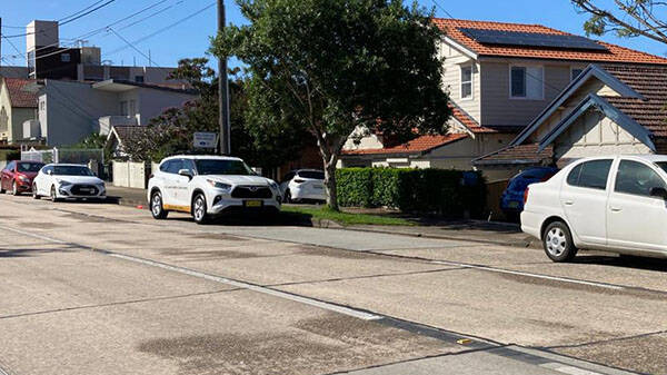 A mobile speed camera (centre, white Chrysler) parked discreetly between two cars on a busy road in Sydney’s inner west has sparked outrage. Picture: 2GB