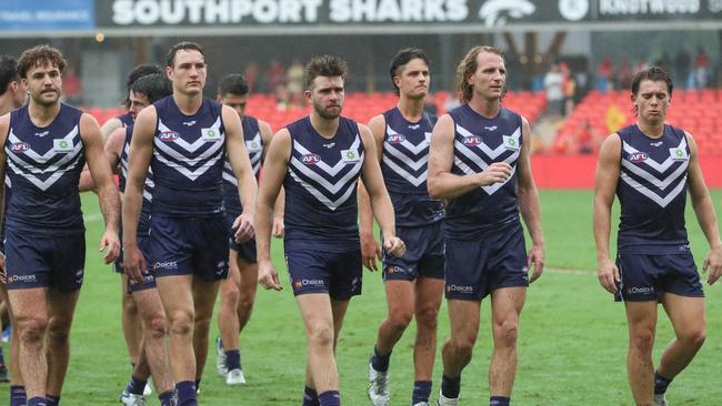 A dejected Fremantle side exits the field after losing to the Gold Coast Suns at Metricon Stadium. Picture: Russell Freeman/AFL Photos via Getty Images