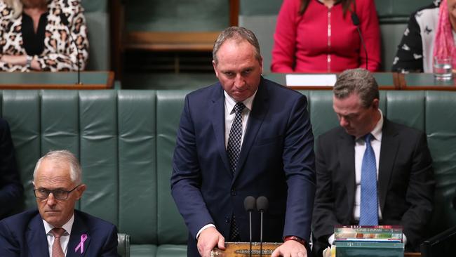 Barnaby Joyce stands to answer a question. Malcolm Turnbull, left, and Christopher Pyne. Picture: Kym Smith