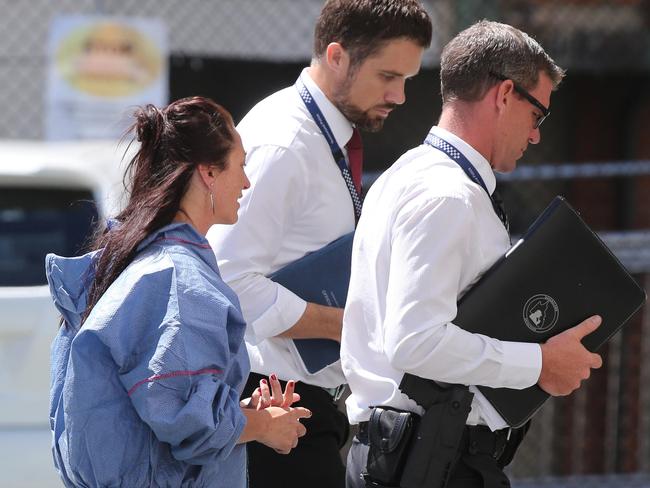 Paania Lawrence being taken into the Southport Watch House before being charged with murder. Picture Mike Batterham