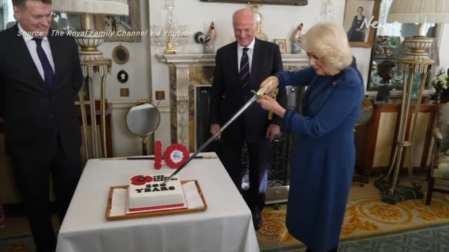 Queen Camilla uses sword to cut cake for The Poppy Factory centenary