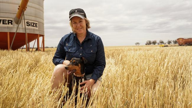 Waitchie farmer Carol Fitzpatrick with her Kelpie Jess, amid the start of the 2024 harvest. Picture: Rachel Simmonds