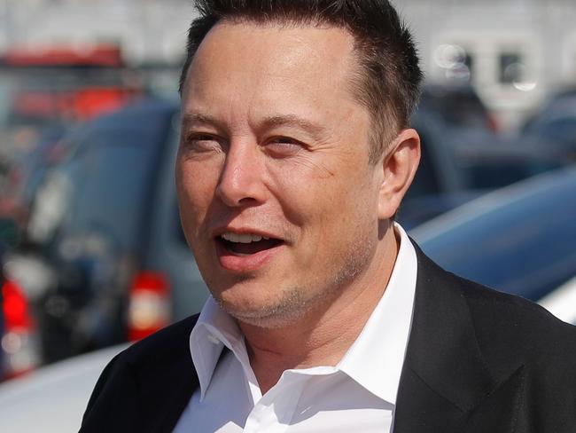 (FILES) In this file photo Tesla CEO Elon Musk gestures as he arrives to visit the construction site of the future US electric car giant Tesla, on September 03, 2020 in GrÃ¼nheide near Berlin. - With his social media prognostications about Bitcoin or GameStop, Elon Musk has been venturing further away from his own businesses and becoming more like a Wall Street heavyweight who can move markets with just a few words. (Photo by Odd ANDERSEN / AFP)