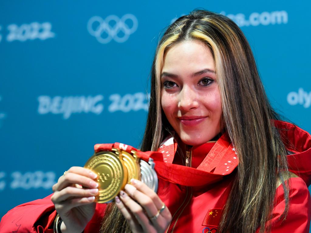 Olympic Skier & Model Eileen Gu Poses With Her Gold Medals in Red