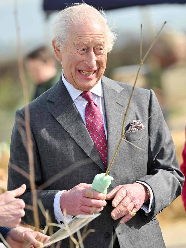 The monarch was in good spirits while meeting producers at Broighter Gold Farm. Picture: AFP