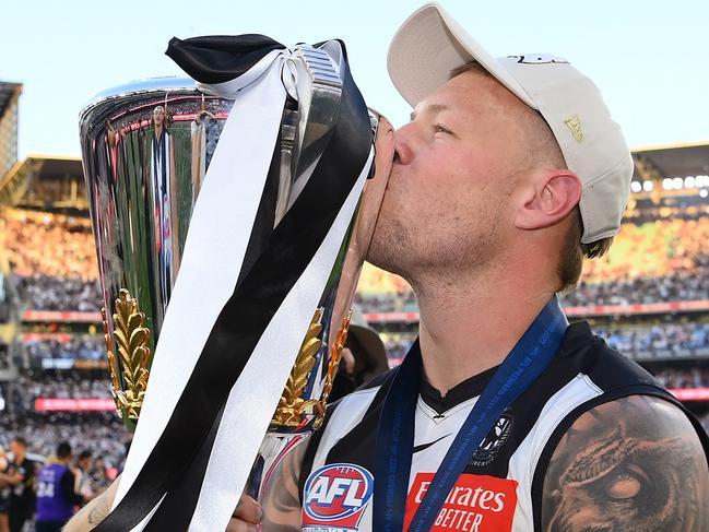 MELBOURNE, AUSTRALIA - SEPTEMBER 30: Jordan De Goey of the Magpies celebrates winning with the AFL Premiership Cup during the 2023 AFL Grand Final match between Collingwood Magpies and Brisbane Lions at Melbourne Cricket Ground, on September 30, 2023, in Melbourne, Australia. (Photo by Quinn Rooney/Getty Images)