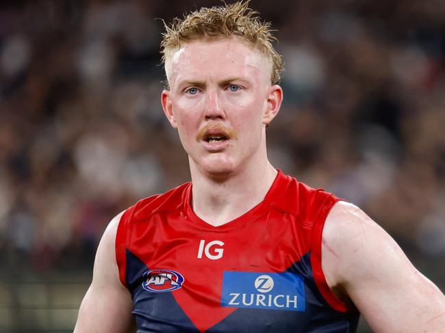 MELBOURNE, AUSTRALIA - SEPTEMBER 15: Clayton Oliver of the Demons looks dejected after a loss  during the 2023 AFL First Semi Final match between the Melbourne Demons and the Carlton Blues at Melbourne Cricket Ground on September 15, 2023 in Melbourne, Australia. (Photo by Dylan Burns/AFL Photos via Getty Images)