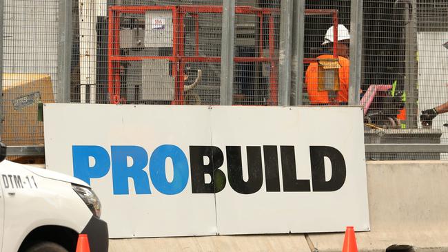 Workers leave the Probuild worksite on 443 Queen Street. Picture: Zak Simmonds