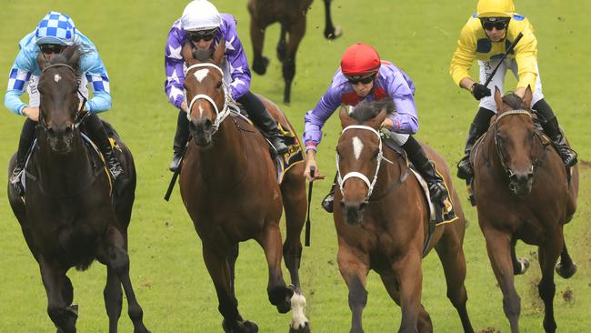 Jason Collett on Oscar Zulu (red cap) wins the Schweppes Handicap.