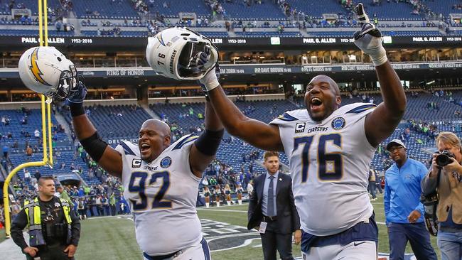 Brandon Mebane and Russell Okung of the Los Angeles Chargers head off the field following the win over the Seattle Seahawks. Picture: Getty