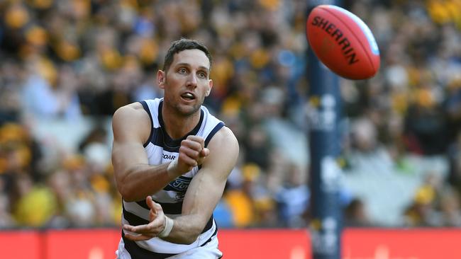 Harry Taylor gives the hands during the Cats’ win over the Hawks. Picture: AAP