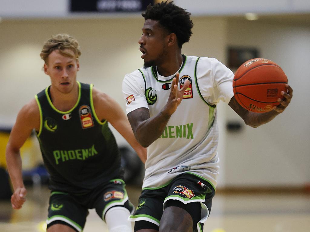 Every practice is a battle for South East Melbourne Phoenix point guards Kyle Adnam and Xavier Munford. Picture: Alex Coppel