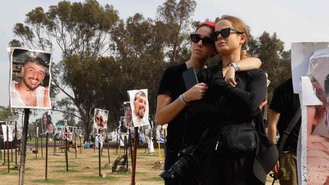 Women gather at the abandoned site of the Supernova music festival after the attack by Hamas militants on October 7, near Kibbutz Reim in southern Israel, on December 17, 2023. Picture: AFP