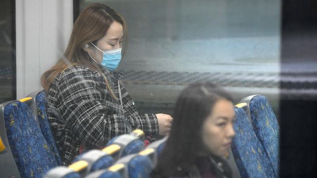 Government advice is for people to ‘consider’ wearing masks on public transport if they cannot socially distance. Picture: Bianca De Marchi / NCA NewsWire