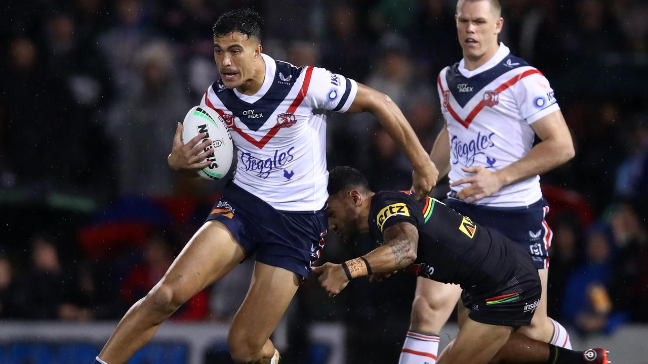 Joseph Suaalii tries to break free against the Panthers. Picture: Jason McCawley/Getty Images