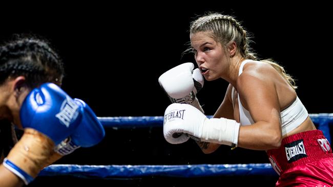 Queensland professional boxer Taylah Robertson (white gloves) fighting Logan-based fighter Mai Nixon in March, 2021, at Nissan Arena, Brisbane. Photo: Andrew Davies.