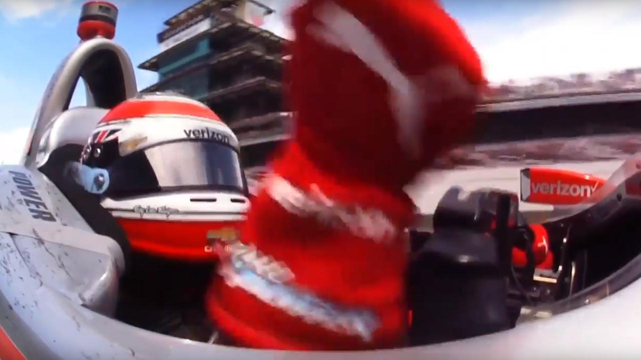 Will Power celebrates as he crosses the line to win the Indianapolis 500.