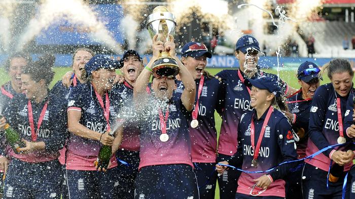 England players celebrate with the trophy after winning the ICC Women's World Cup 2017 final match against India at Lord's in London, England, Sunday, July 23, 2017. (AP Photo/Rui Vieira)