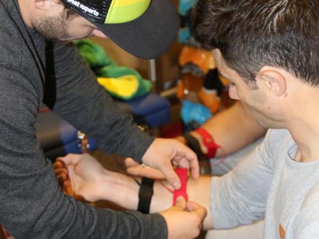 Cooper Cronk being fitted with his sweat tester device. Pic: NRL Photos