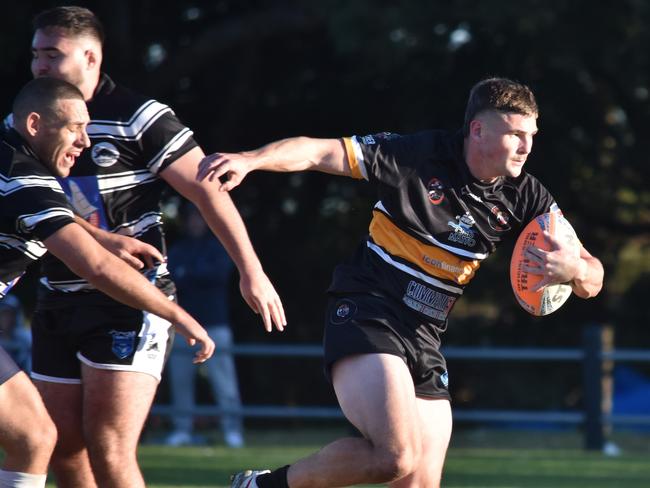 Kyle Wilson breaks through a tackle. Picture: Sean Teuma/NewsLocal