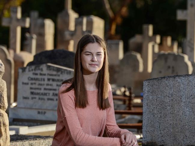 AUGUST 7, 2021: WW1 teen slueth Lara Dawson at the unmarked grave of Pte Patrick Aloysius Byrne in West Terrace Cemetery. He died in 1922 and is related to former Prime Minister Sir John McEwen. Picture: Brenton Edwards