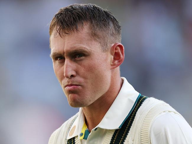 PERTH, AUSTRALIA - NOVEMBER 22: Marnus Labuschagne of Australia walks off the field after being dismissed by Mohammed Siraj of India for 2 runs during day one of the First Test match in the series between Australia and India at Perth Stadium on November 22, 2024 in Perth, Australia. (Photo by Cameron Spencer/Getty Images)