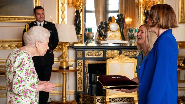 The Queen presents the George Cross to Caroline Lamb and Ms Eleanor Grant. Picture: AFP