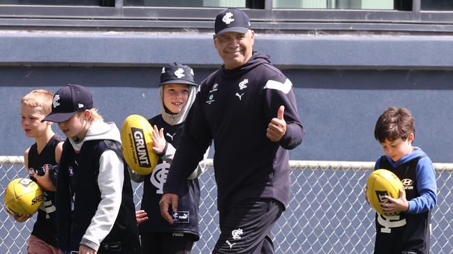 AFL legend Greg Williams mentors kids at Carlton training. Photo: Michael Klein