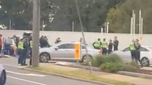 A swarm of officers arrested three offenders at a service station in Macleod after they fled from a stolen car in Bundoora. Picture: Supplied