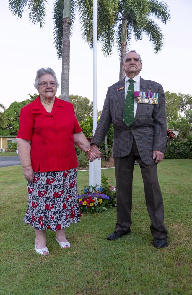 VC recipient Keith Payne lays a wreath on his front lawn with wife Flo at dawn on Anzac Day in Mackay, Queensland, Saturday, April 25, 2020. Picture: Daryl Wright