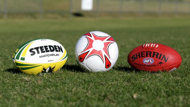 Generic football shots. Steeden Rugby League NRL football, soccer ball and Sherrin AFL football. sport / balls