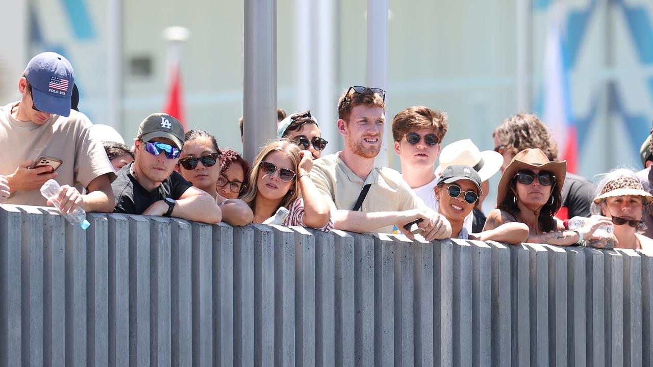 Fans, particularly those with ground passes, move around the Melbourne Park precinct and between courts throughout the day. (Photo by Kelly Defina/Getty Images)