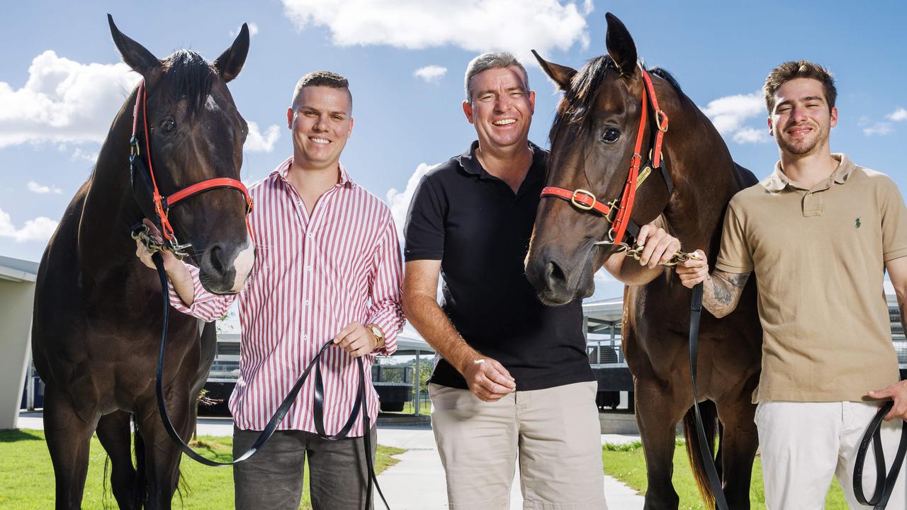 Sunshine Coast trainer Stuart Kendrick with his two sons Nathan and Bayley and brother horses Defiant Spirit and Defiant Boom. Picture: Lachie Millard.