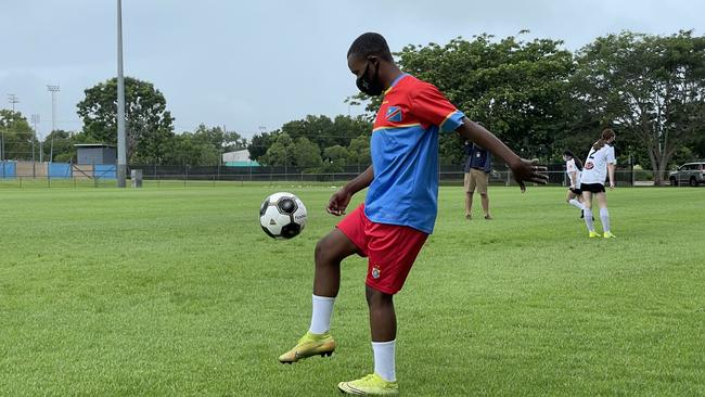 Refugee World Cup competitor Hope Espoir warms up before the event begins on Australia Day. Picture: Ben Cameron