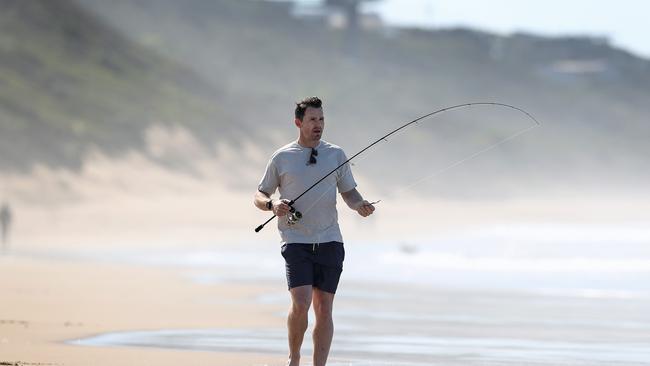 Patrick Dangerfield in his happy place on the beach at Moggs Creek. Picture: Michael Klein.