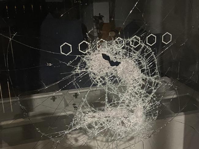 The damage left after youths with golf clubs smashed a window at Sky News reporter Matt Cunningham's Darwin home during a terrifying attempted break-in while he and his family were home.