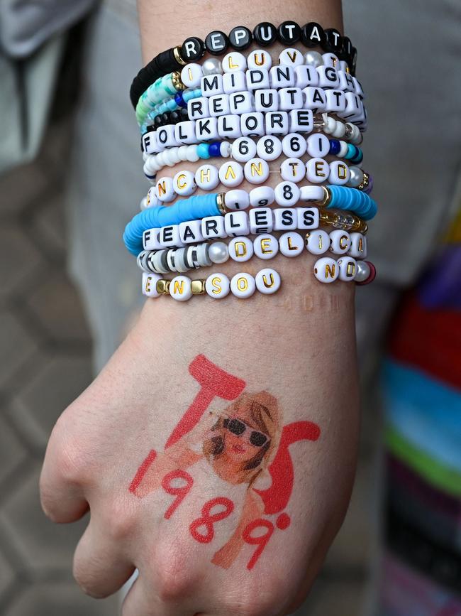 A Swiftie’s friendship bracelets. Picture: Roslan Rahman/AFP