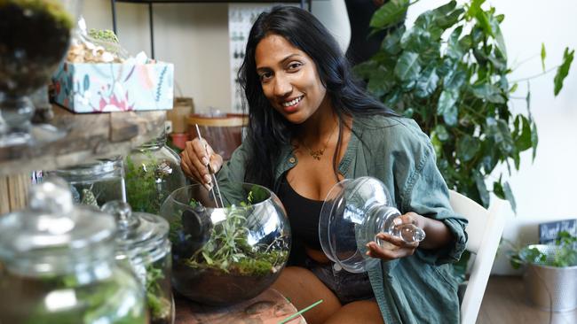 The Green Room has moved to a larger premises at Stratford and expanded to include a cafe. Green Room co-owner Rebecca Manik with the store's terrariums for sale. Picture: Brendan Radke