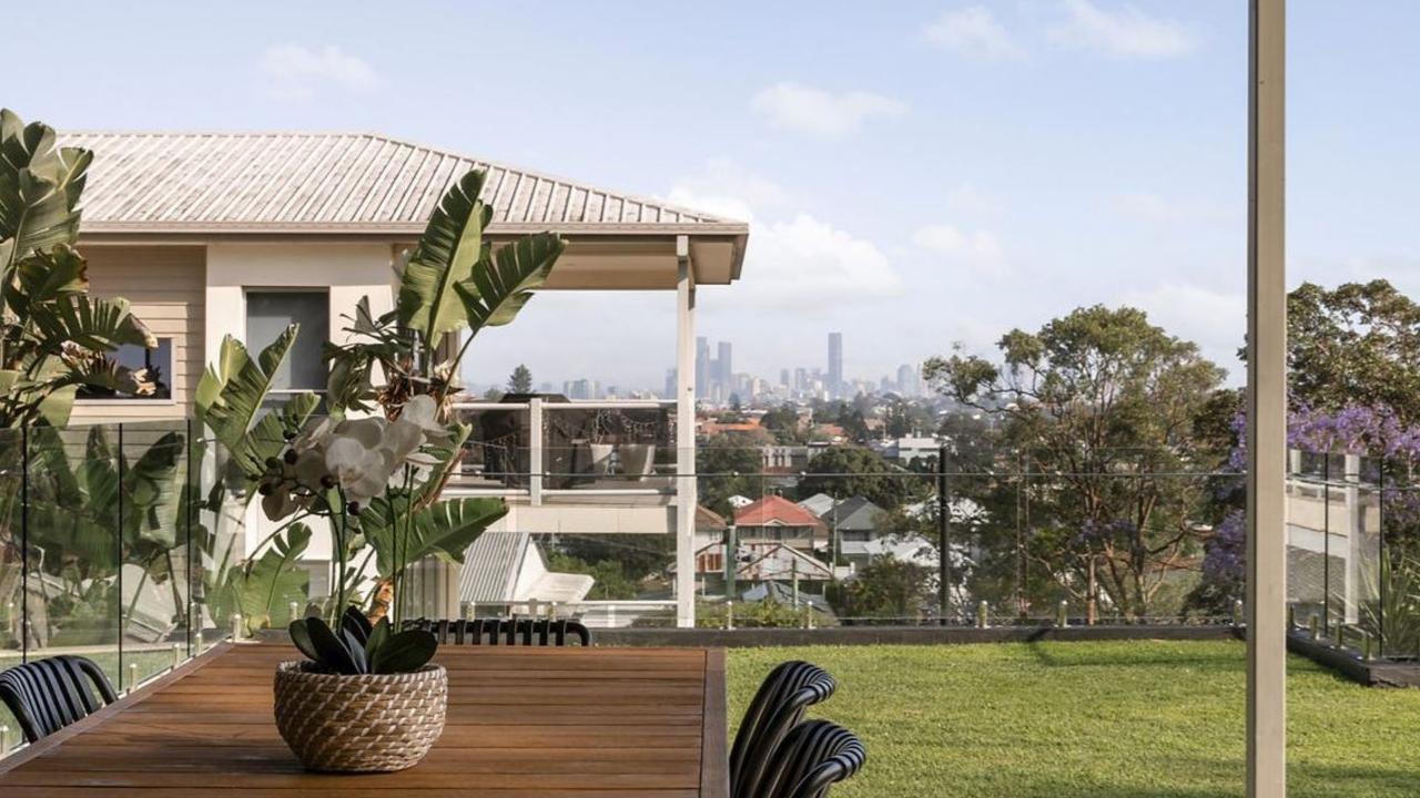 Bidders arrived on the rainy morning to compete for the property under shelter, with a view of the city in the distance.