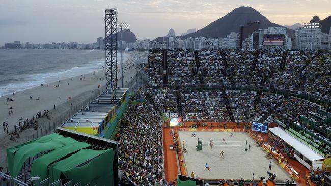 A view of Rio’s Copacabana beach and the Olympic beach volleyball stadium at dusk. Australian athletes have been banned from going on the sand at Copacabana and Ipanema after 6pm.