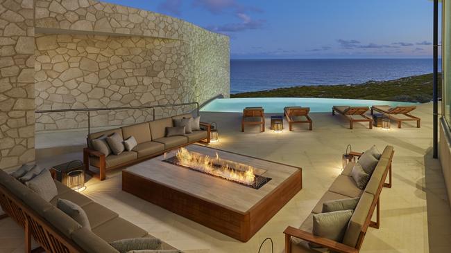 An outside fireplace takes in the breathtaking views on offer at the Southern Ocean Lodge. Picture: Supplied