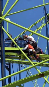 Roller coaster pushed by hand to get rolling again