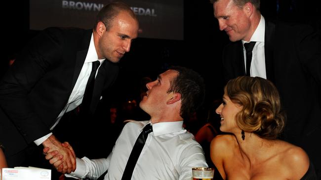 Dane Swan is congratulated by Chris Judd after winning the Brownlow Medal in 2011.